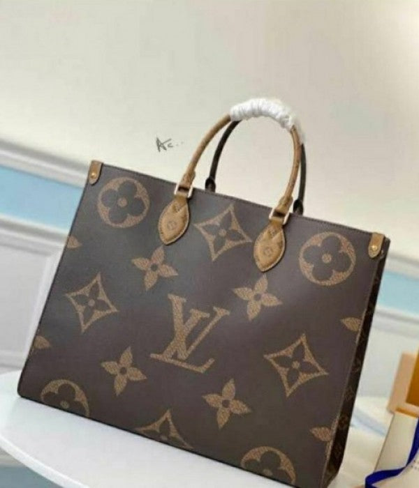 LV ON THE GO TOTE BAG WITH DUST BAG XoticCollection