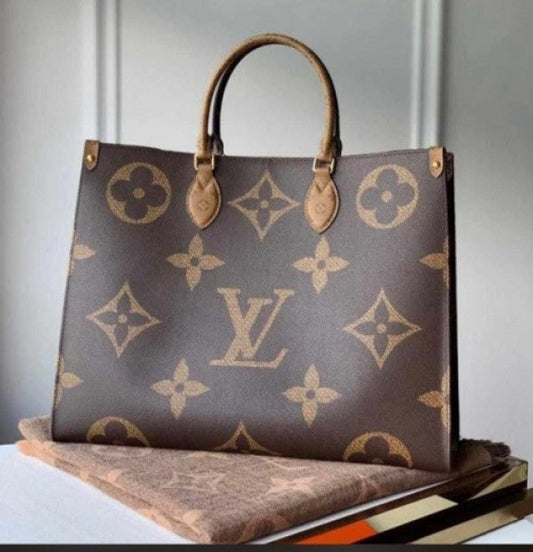 LV ON THE GO TOTE BAG WITH DUST BAG XoticCollection